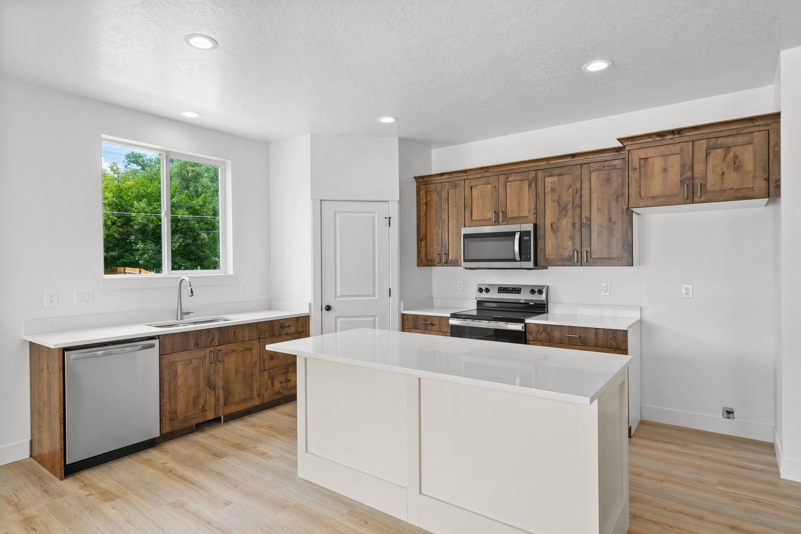 Knotty alder kitchen with white island