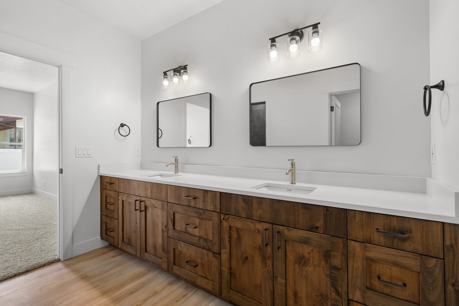 Double vanity with knotty alder cabinetry